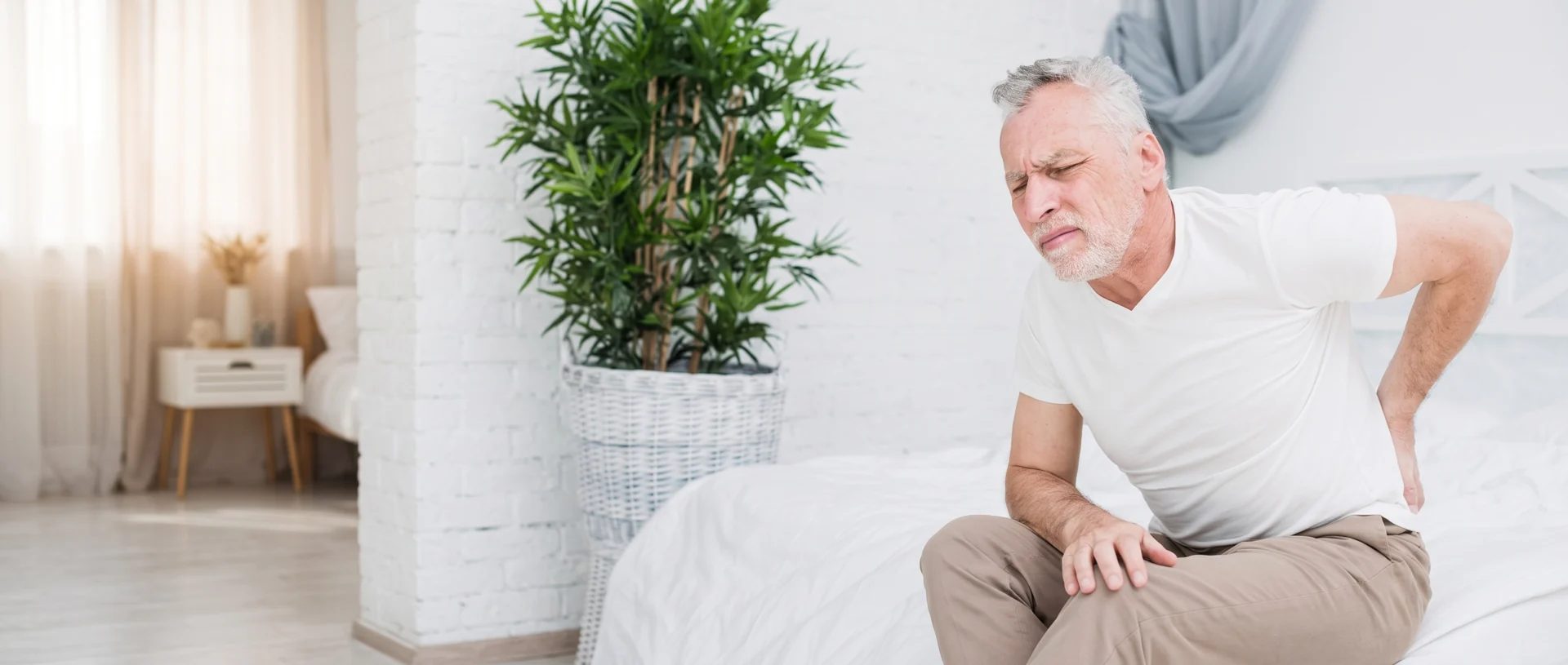 Man experiencing lower back discomfort