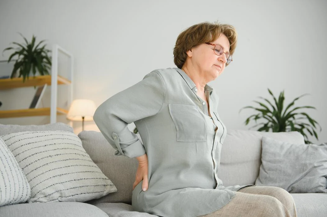 Woman experiencing back discomfort