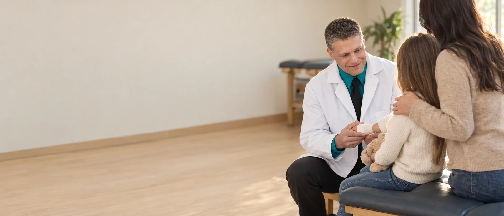 Chiropractic consultation with a mother and child